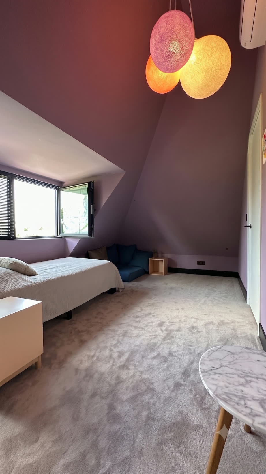 Attic bedroom in soft aubergine tones