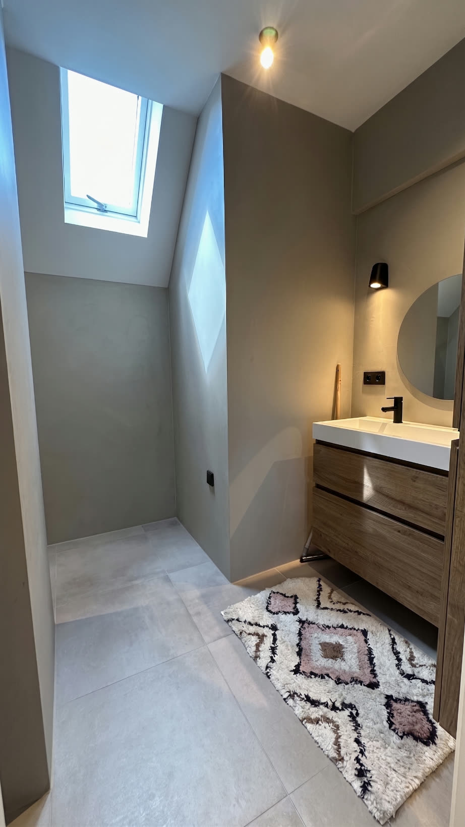 Second-floor bathroom lit by a skylight