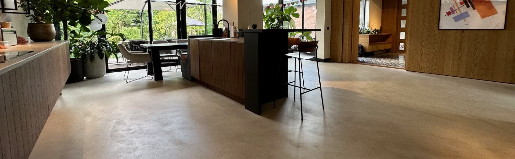 Kitchen with a large island opening onto the dining conservatory
