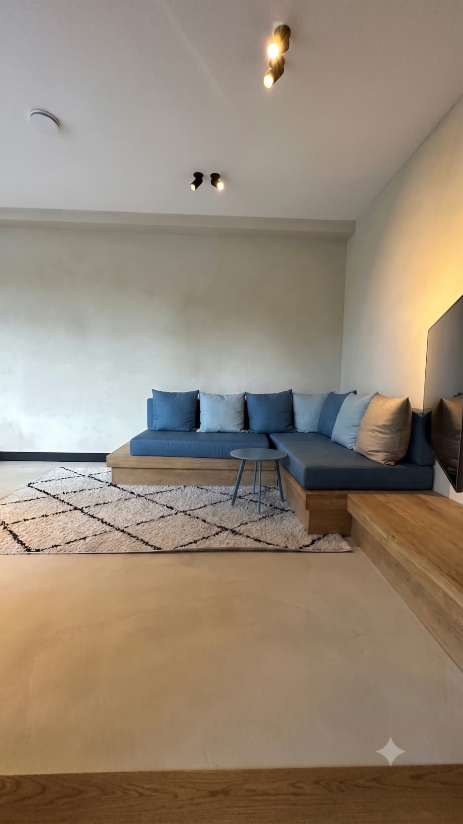Playroom and TV room with a built-in blue sofa