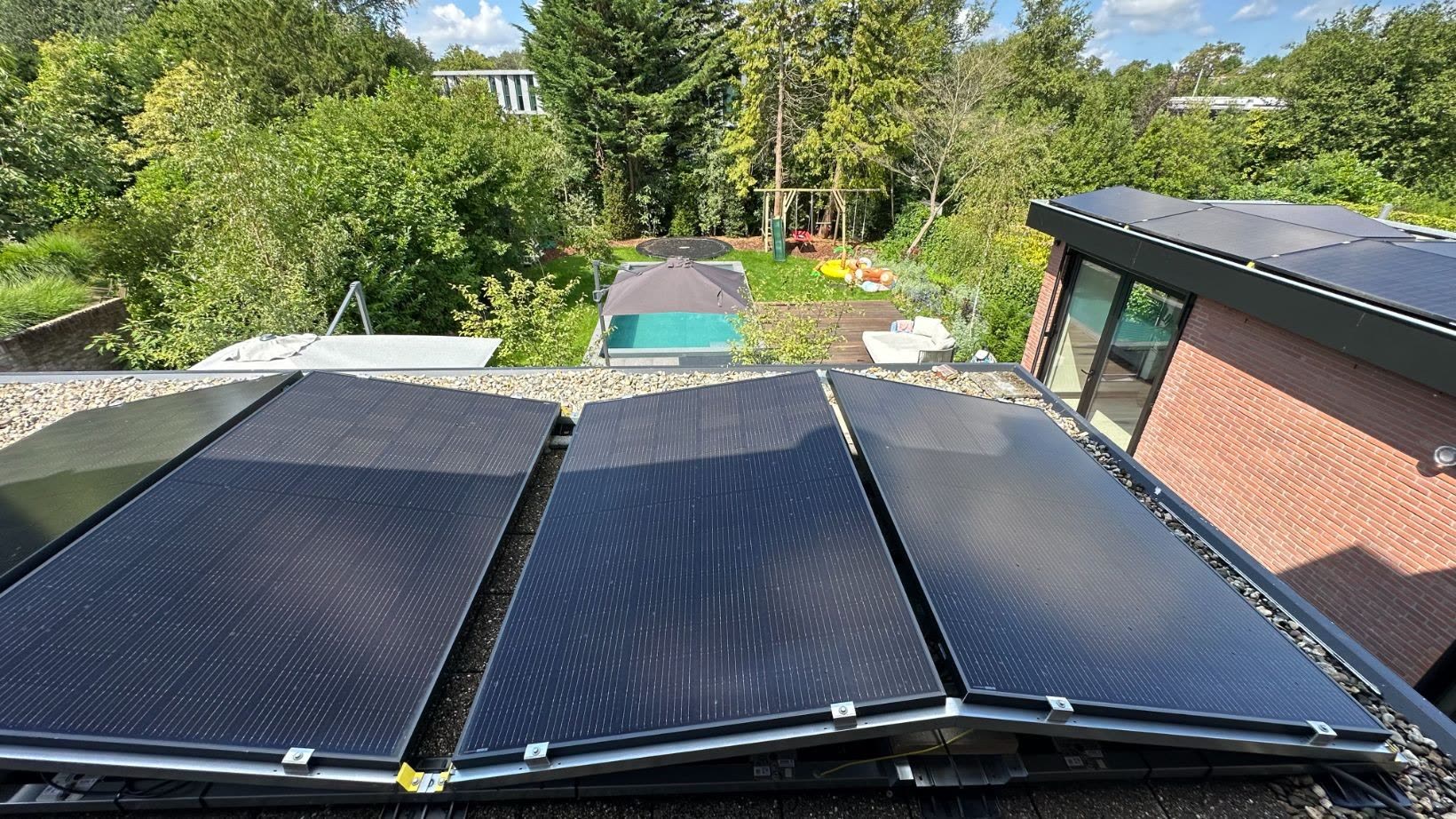 Solar panels on the flat roof overlooking the garden